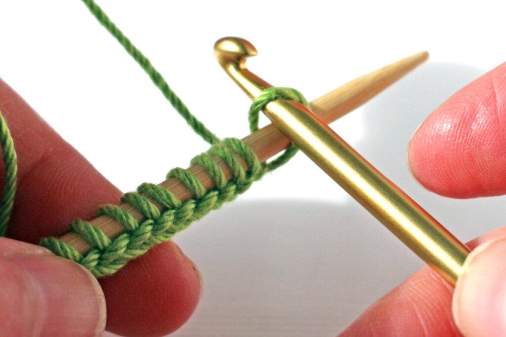 Transfer loop from crochet hook to knitting needle