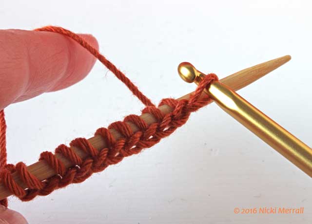 Continue casting on stitches in waste yarn until you have required number