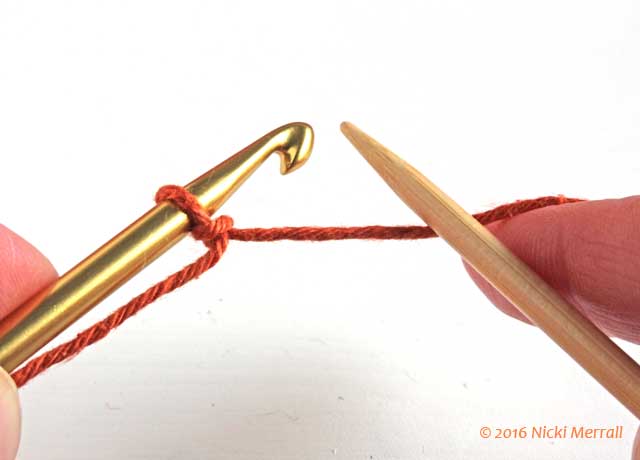 Start crochet provisional cast-on using waste yarn; hold hook in your left hand and knitting needle in your right hand