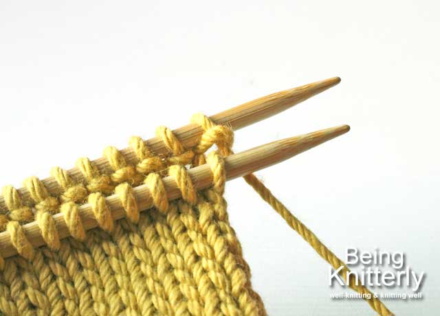 Start grafting by holding two pieces of knitting purl sides together with yarn at back