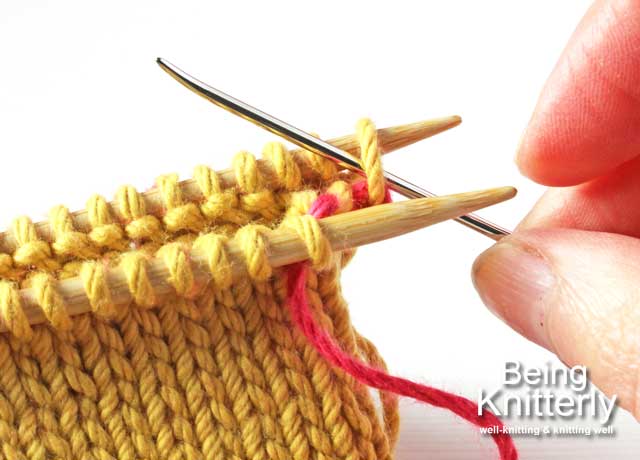 Stitching step 3a: Pass yarn needle purlwise through first stitch on back needle