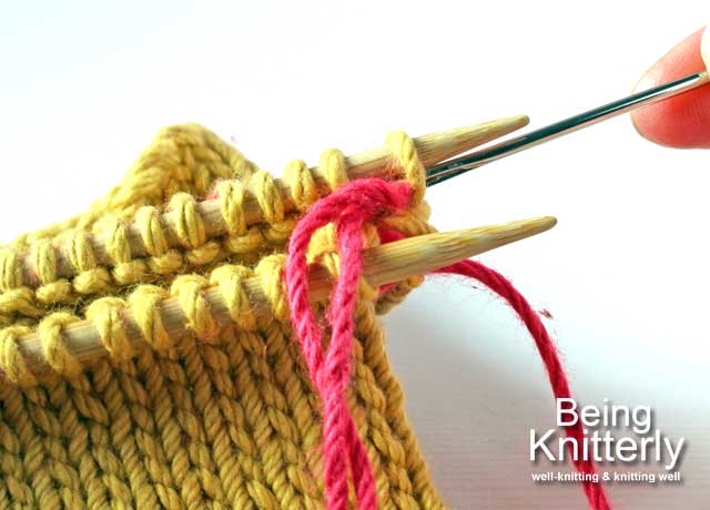 Stitching step 4a: Pass yarn needle knitwise through next stitch on back needle