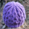 View of purple cabled beanie from back