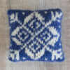 Fair Isle style lavender bag with white star on royal blue background