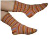 Hand-knitted patterned socks in orange, blue and purple stripy yarn